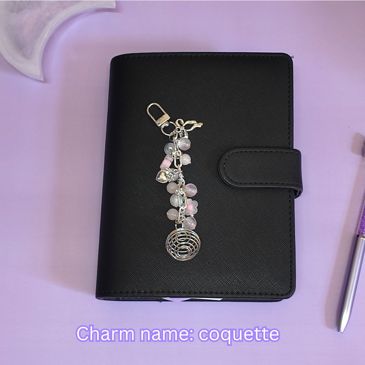 Crystal cage binder charm