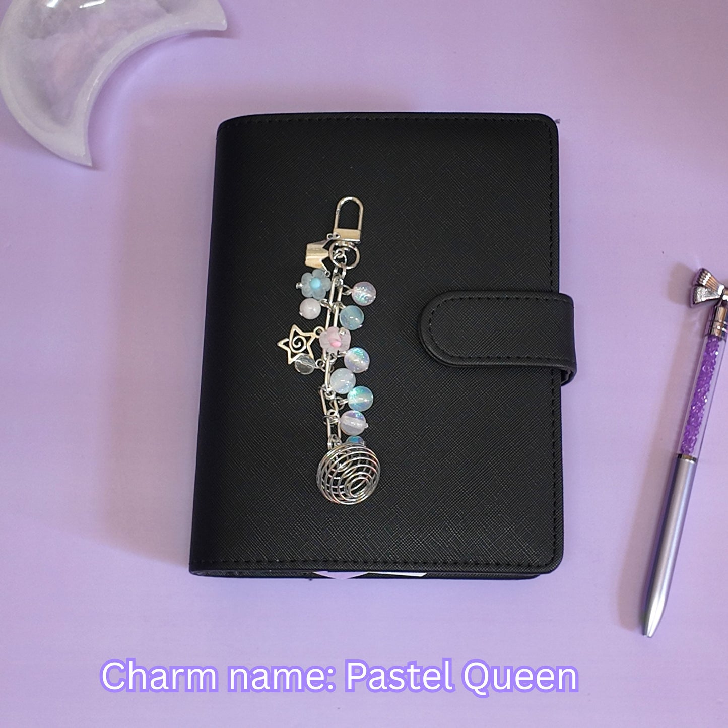 Crystal cage binder charm