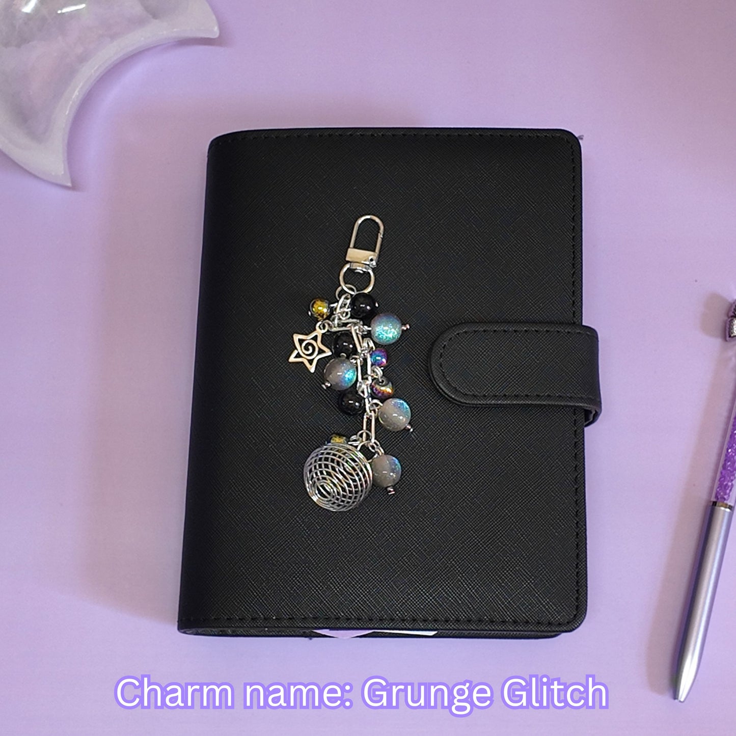 Crystal cage binder charm