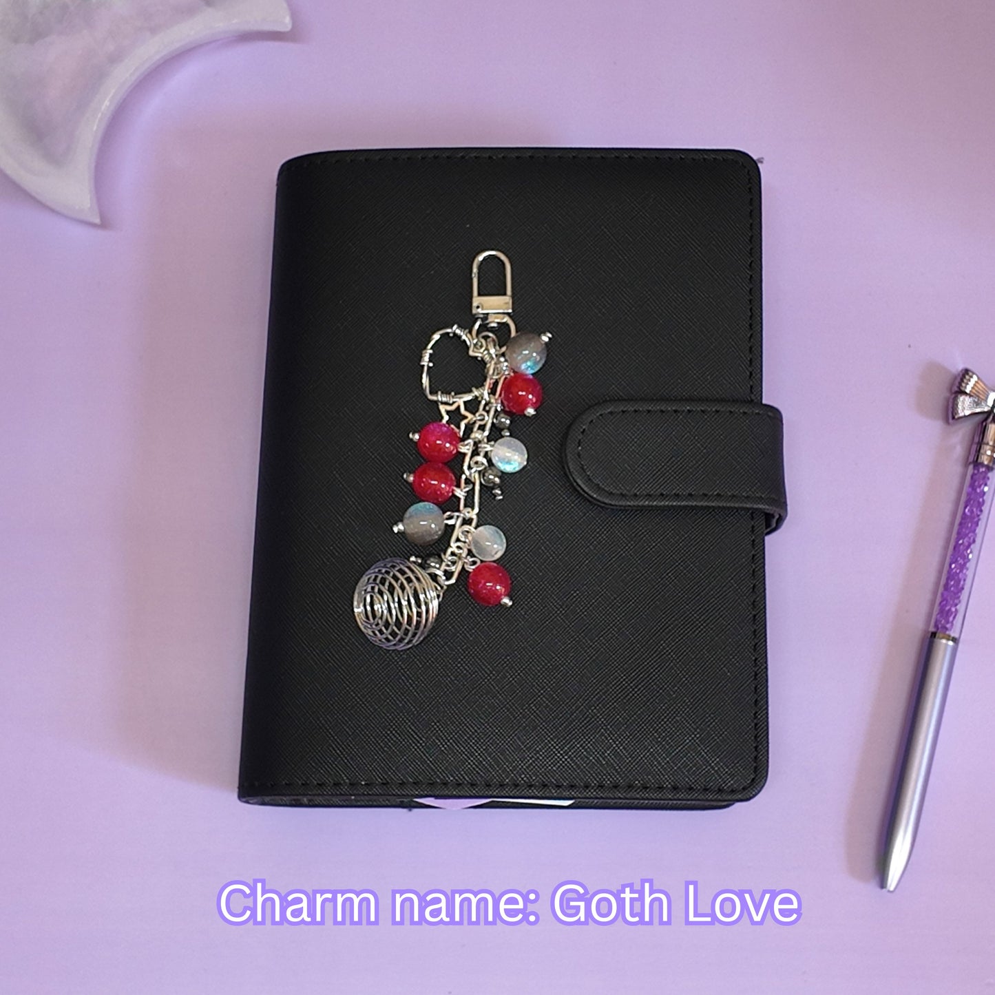 Crystal cage binder charm