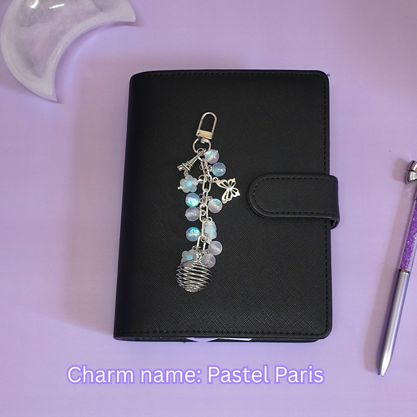Crystal cage binder charm