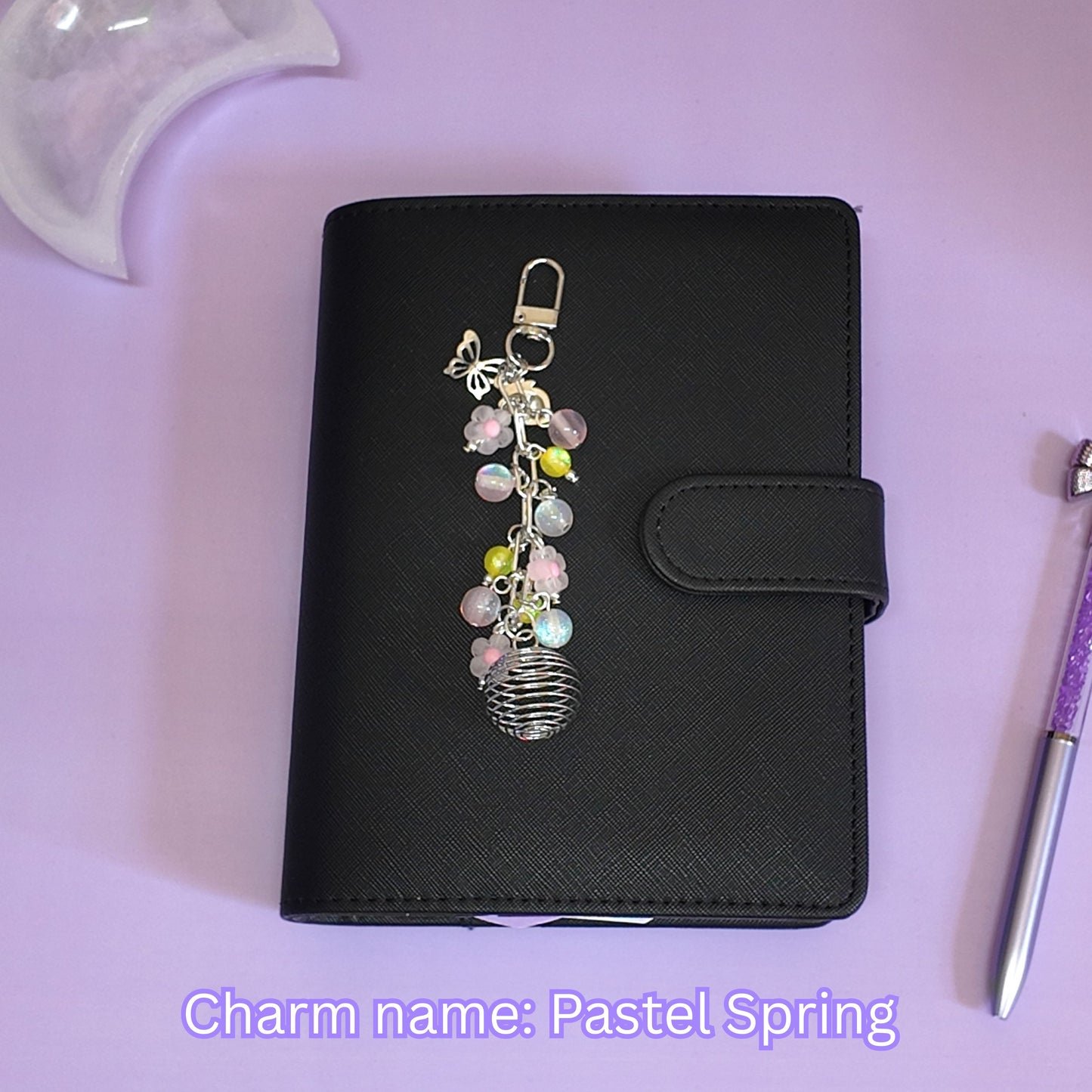 Crystal cage binder charm